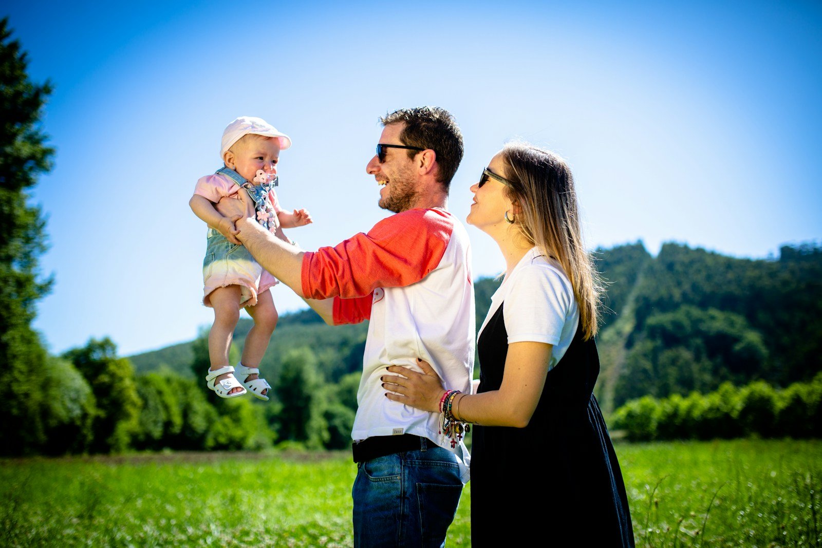 happy parents with child | practical english language training for life in the U.S.