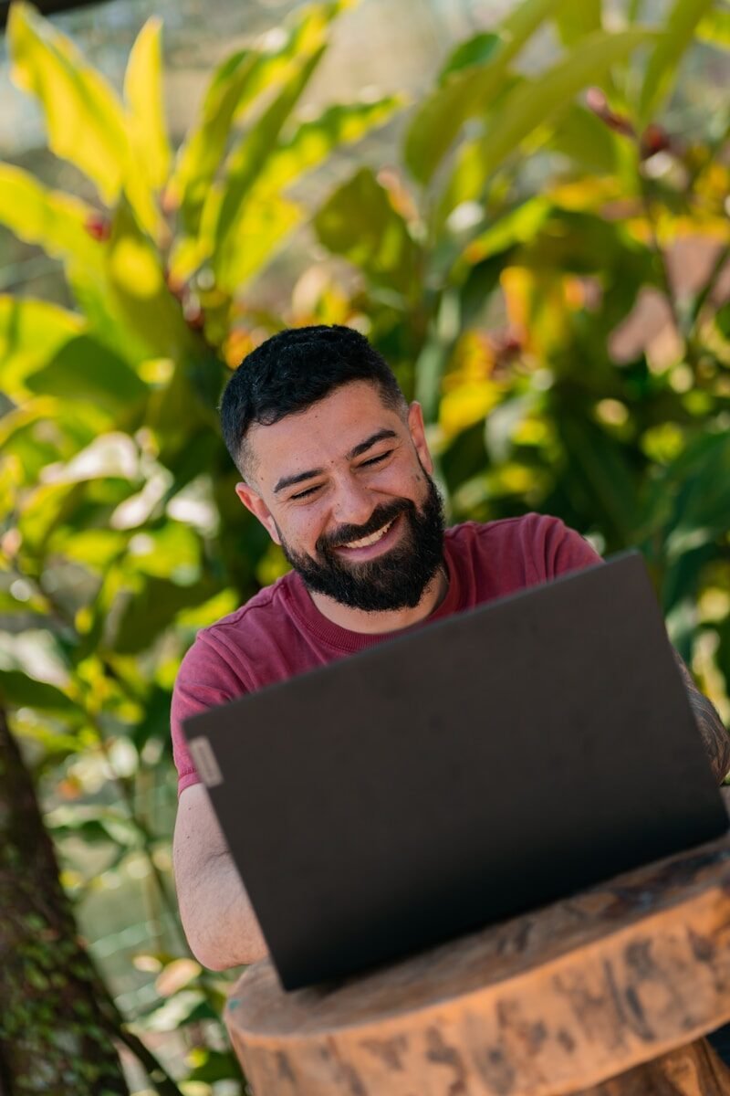 a man with a beard smiling